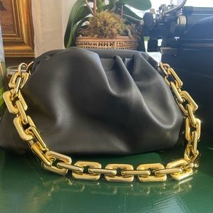 Adorably cute small pleather pouch style bag with thick gold chain strap
